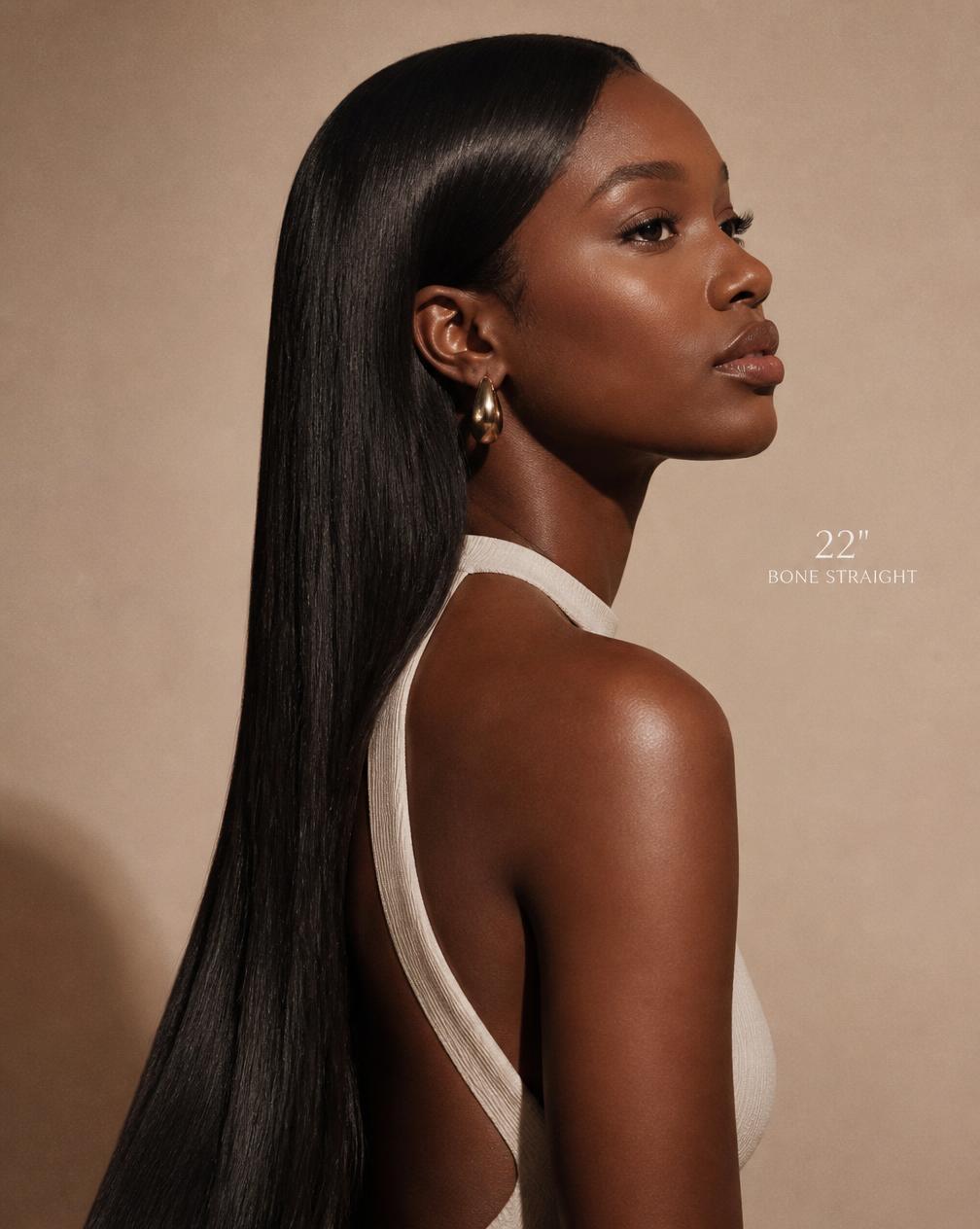 Model in profile wearing The Zara silky straight 22 inch wig